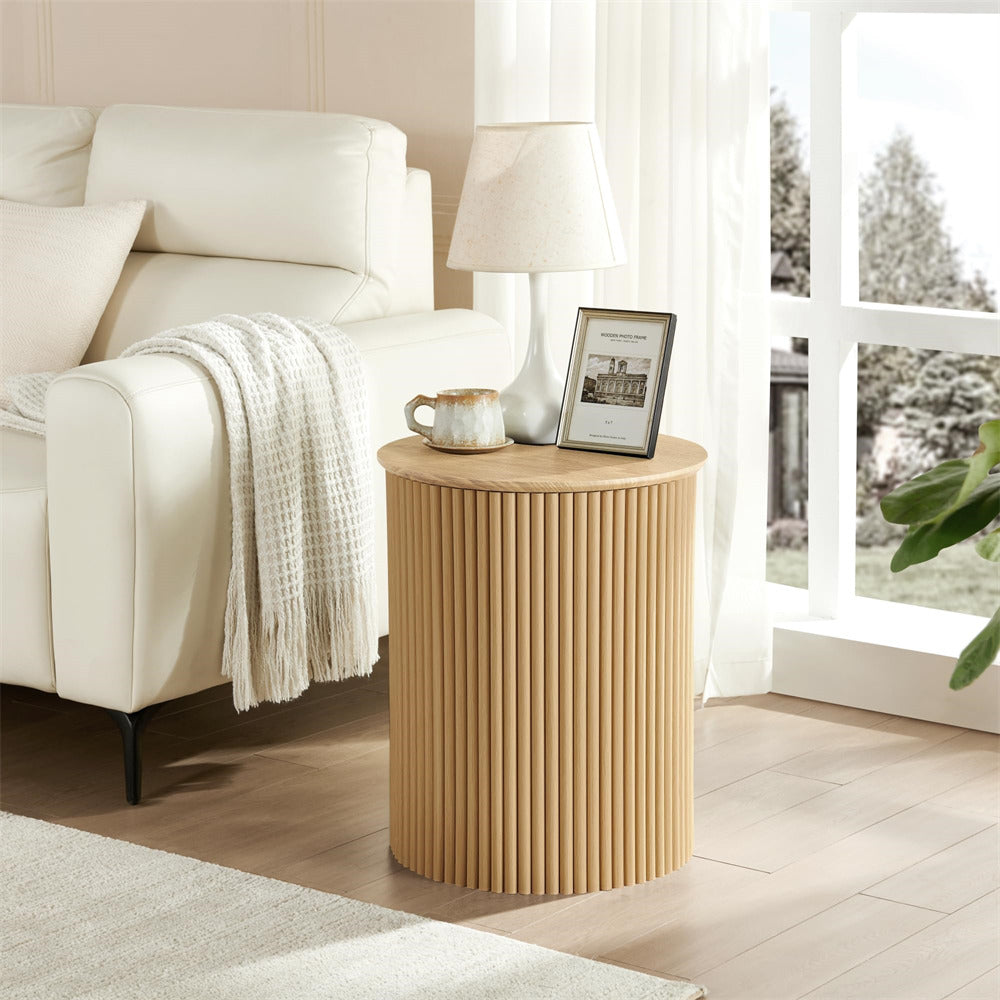 Wooden side table in a living room with a lamp and decorative items.