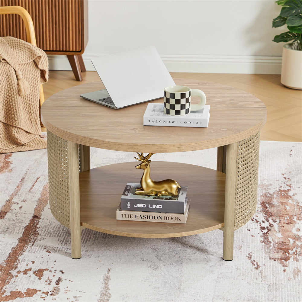 Round wooden coffee table with a laptop, mug, and decorative items in a living room setting.
