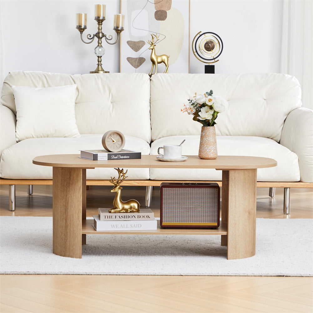 Living room with a white sofa, wooden coffee table, and decorative items.