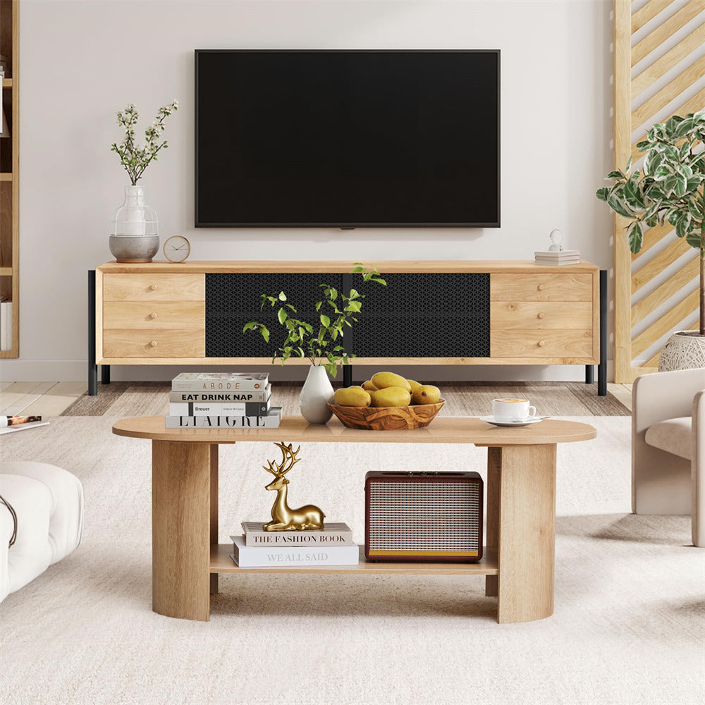 Modern living room with wooden TV stand and coffee table, featuring decor items.