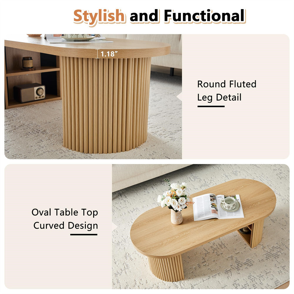 Wooden table with round fluted leg detail and oval table top curved design, shown in a room setting.