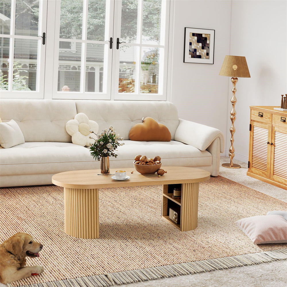 Living room with a beige sofa, wooden coffee table, and decorative items.