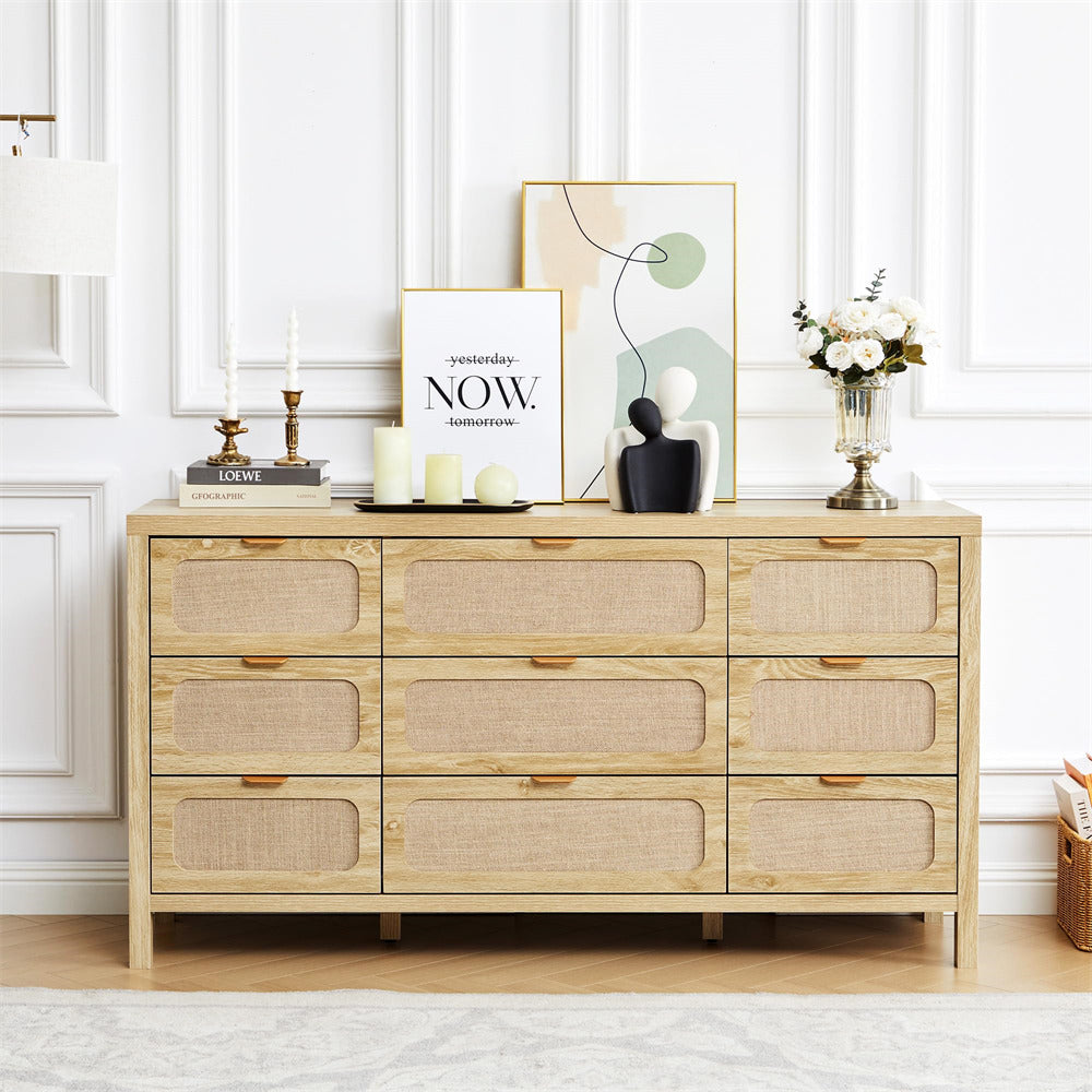 Wooden dresser with decorative items against a white paneled wall