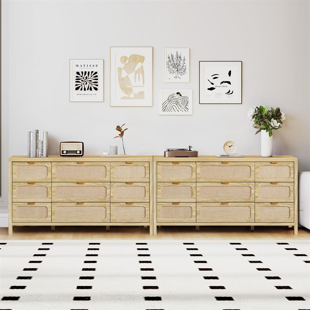 Light wooden sideboard with decorative items against a wall with framed art in a modern living room.