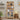 Wooden bookshelf with decorative items in a living room setting