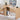 Wooden L-shaped desk with storage shelves, computer setup, and decor items.