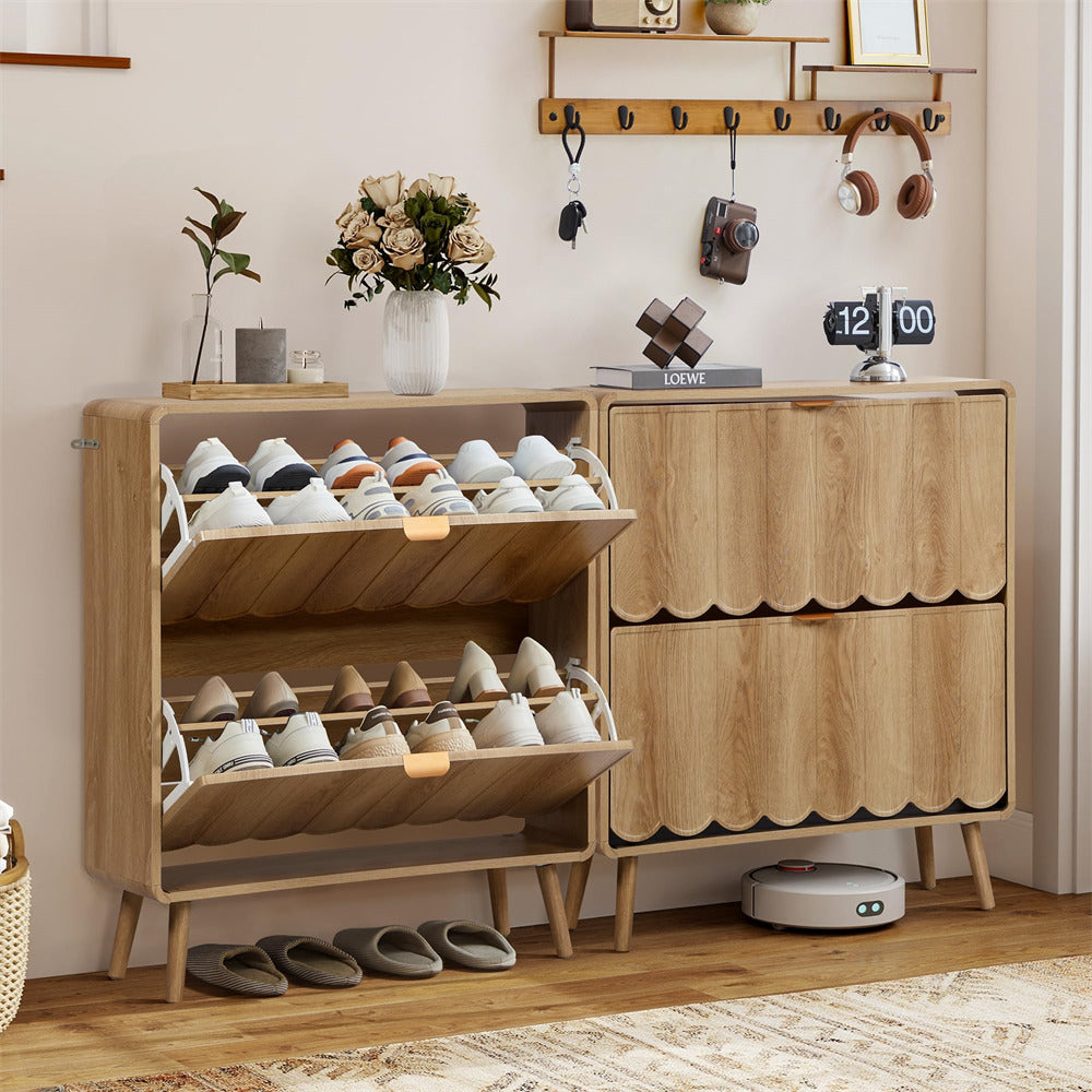 Wooden shoe cabinet with open shelves displaying shoes, a small clock, and decorative items on a wall.