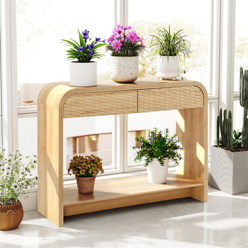 Wooden console table with potted plants in a bright room