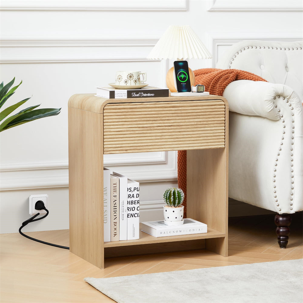 Wooden side table with books and a plant in a living room setting
