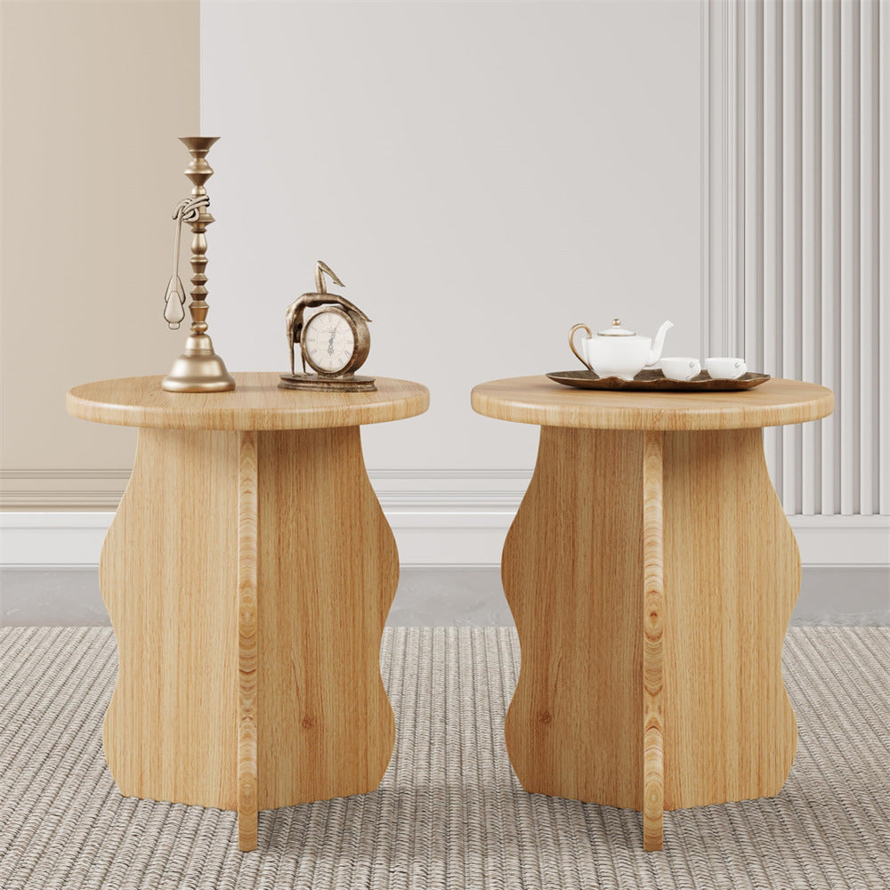 Two wooden side tables with decorative items in a room setting.