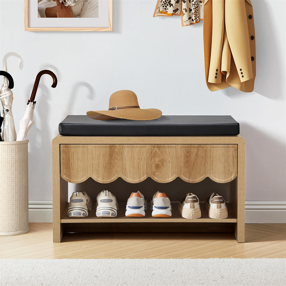 Wooden shoe bench with black cushion, shoes, and a hat in a room setting.