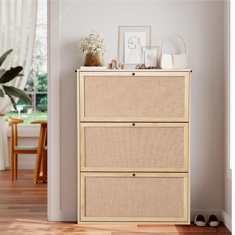 Beige file cabinet with decorative items in a room with a window and chair.