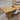 Dining table set with chairs and a decorative runner in a room with blinds.