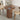 Wooden dining table with chairs in a room setting