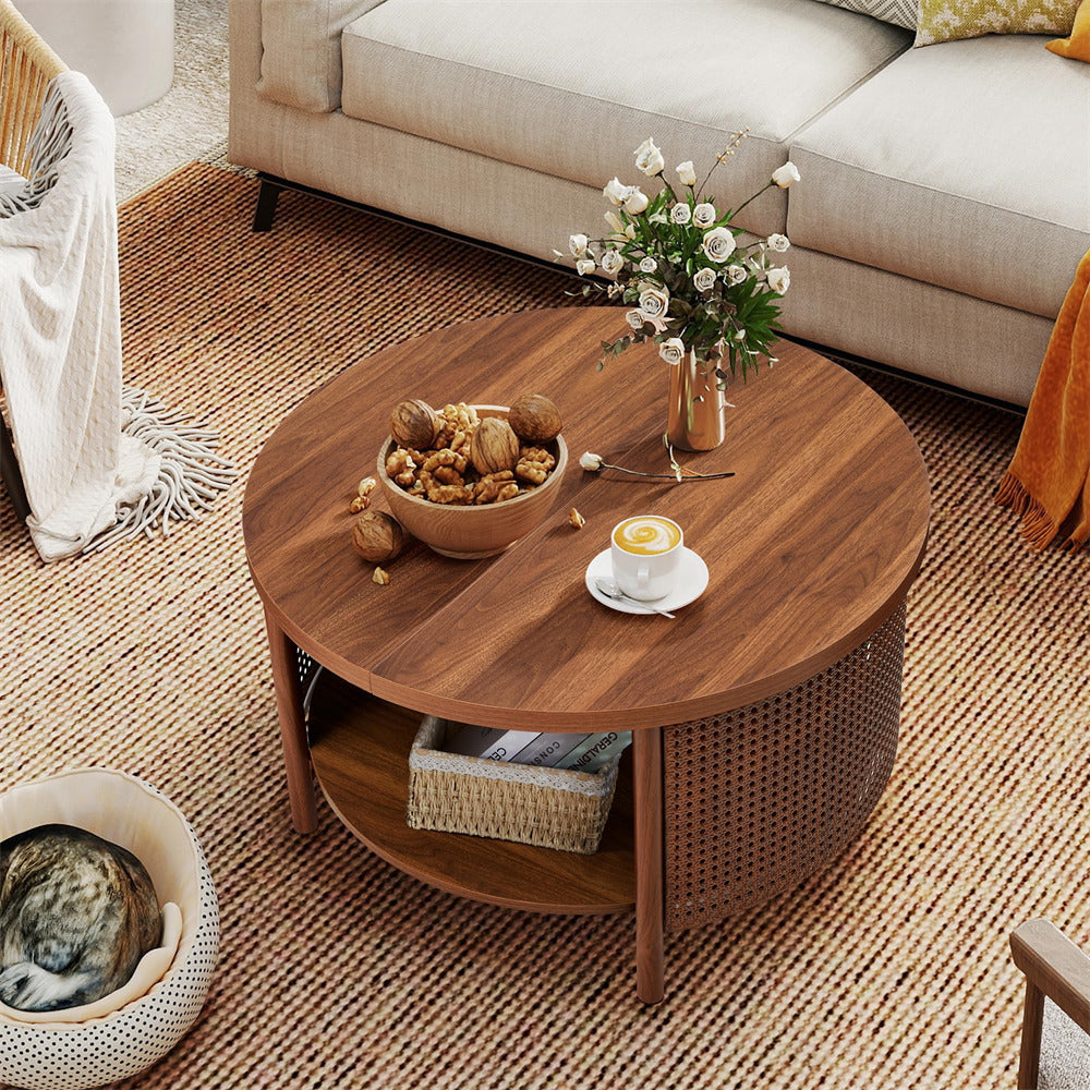 Round wooden coffee table with decorative items in a living room setting