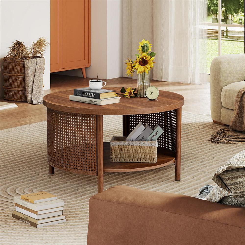 Round wooden coffee table in a living room with books, a clock, and sunflowers.