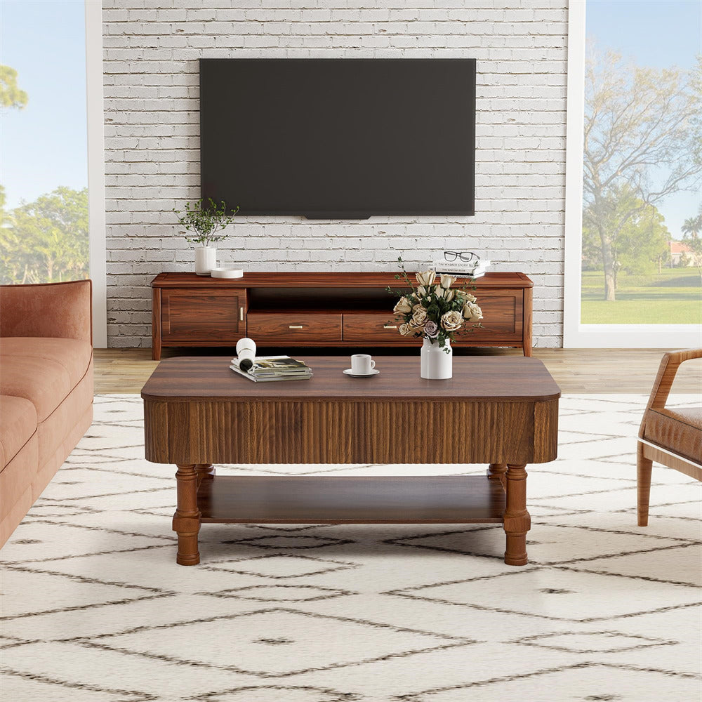 Living room with wooden coffee table, sofa, and TV against a white brick wall.