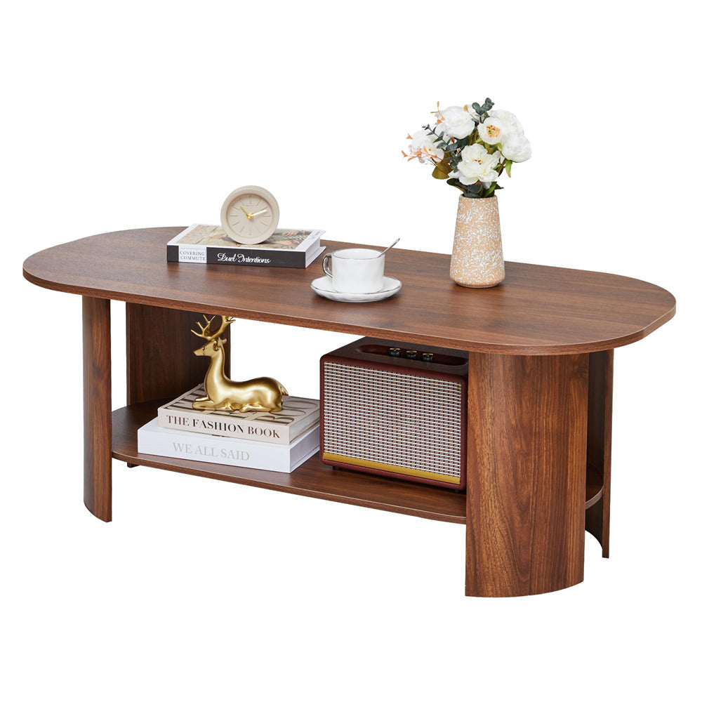 Wooden coffee table with decorative items on a white background