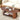 Wooden coffee table with decorative items in a living room setting