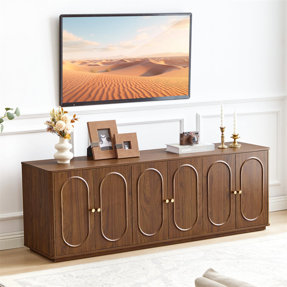 Wooden entertainment console with decorative items in a living room setting