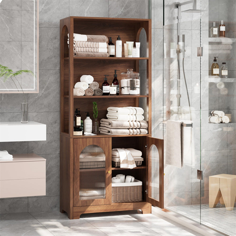 Wooden storage cabinet in a bathroom with towels and toiletries.