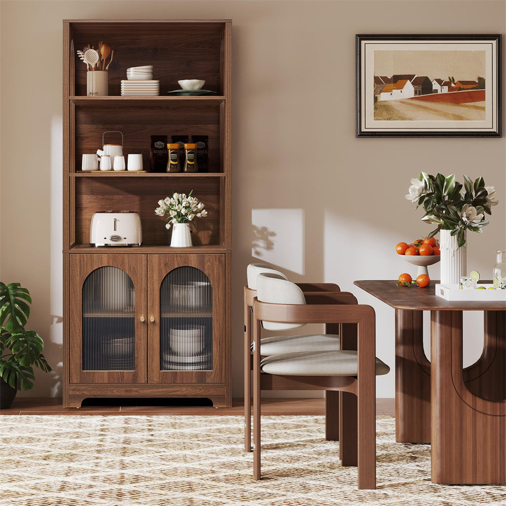 Dining room with wooden cabinet, table, and chairs.