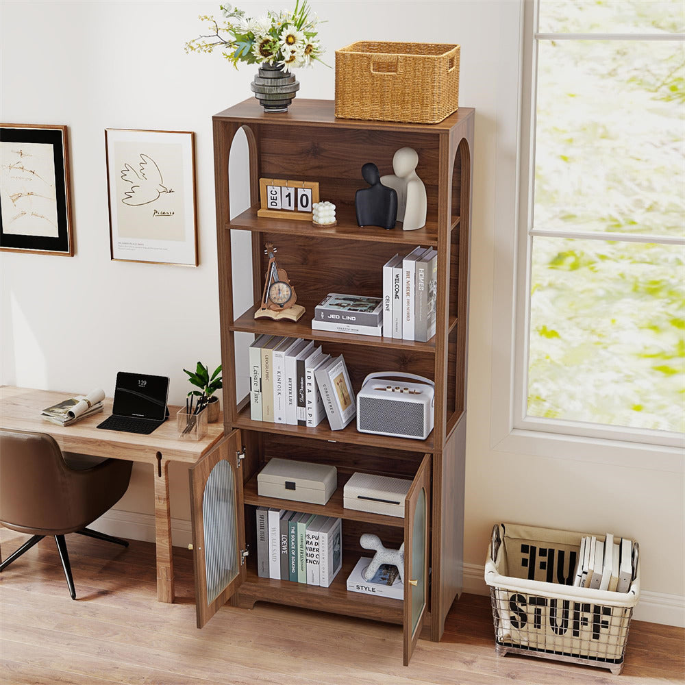 Wooden bookshelf with open doors displaying books and decor in a home office setting.