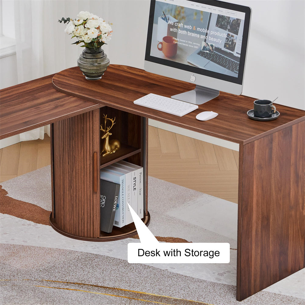 Wooden L-shaped desk with storage compartment, computer setup, and decor items.