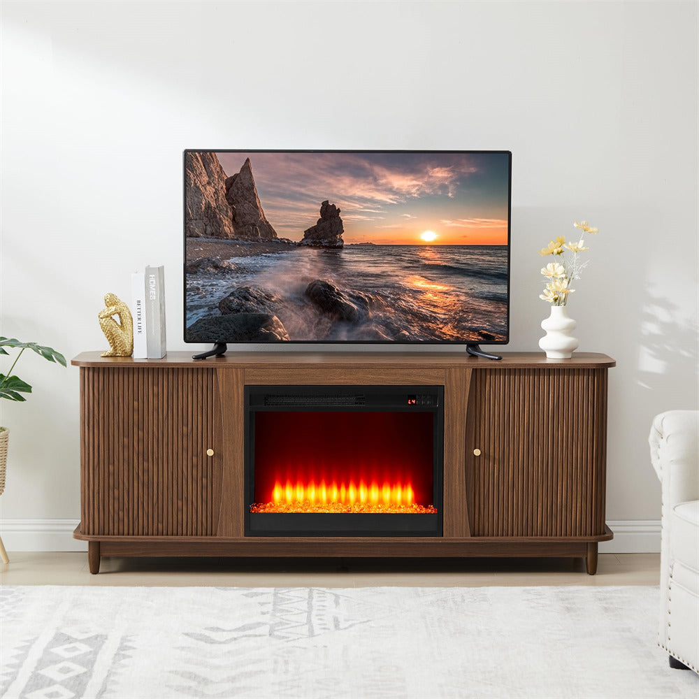 Wooden TV stand with electric fireplace and television displaying a sunset scene.