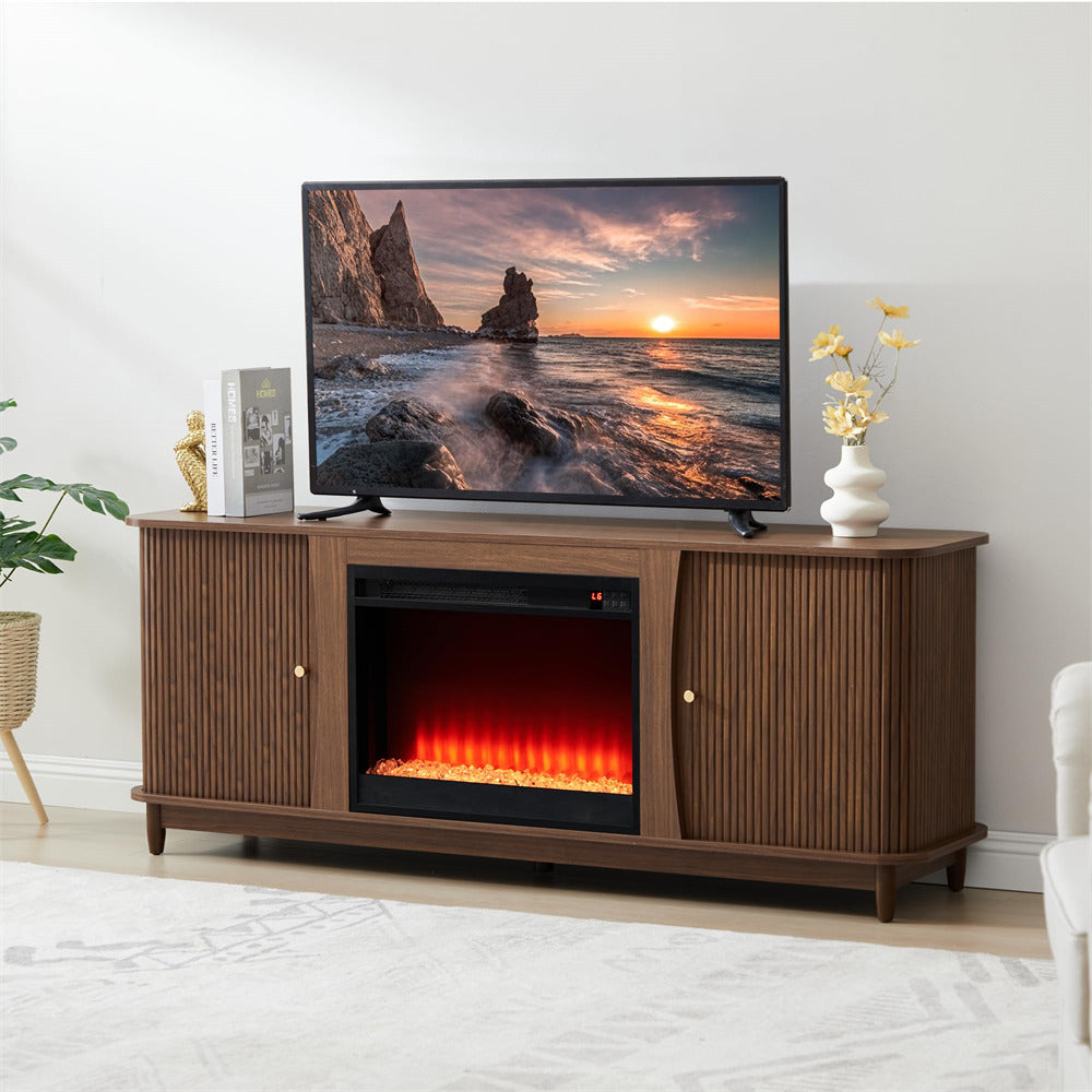Wooden TV stand with electric fireplace and television displaying a sunset scene.