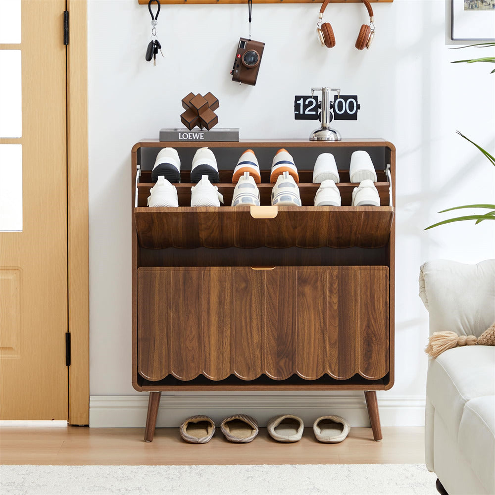 Wooden shoe cabinet with shoes inside, placed in a room with a white wall and a door.