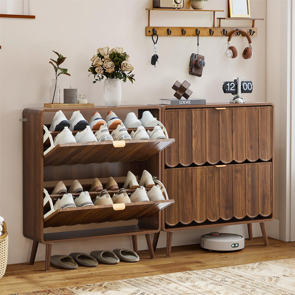 Wooden shoe cabinet with shoe storage and decorative items in a room.