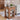 Wooden side table with storage shelves in a living room setting
