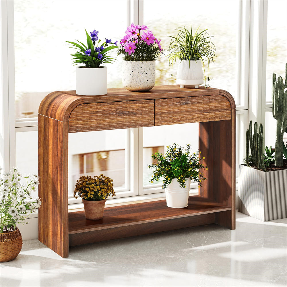 Wooden console table with potted plants in a bright room