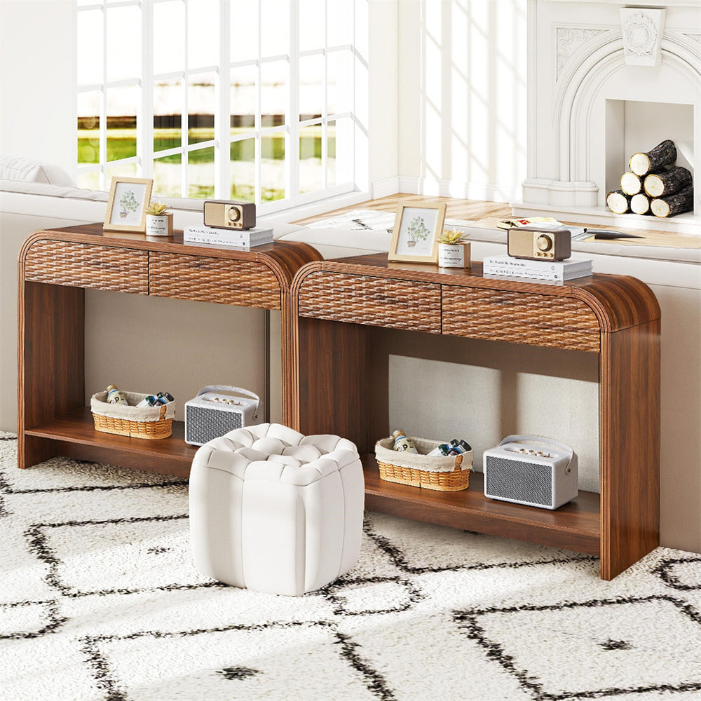 Wooden console table with shelves and decorative items in a room with large windows.