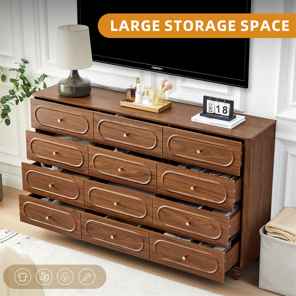 Wooden dresser with multiple drawers in a room setting, featuring a lamp and decorative items.