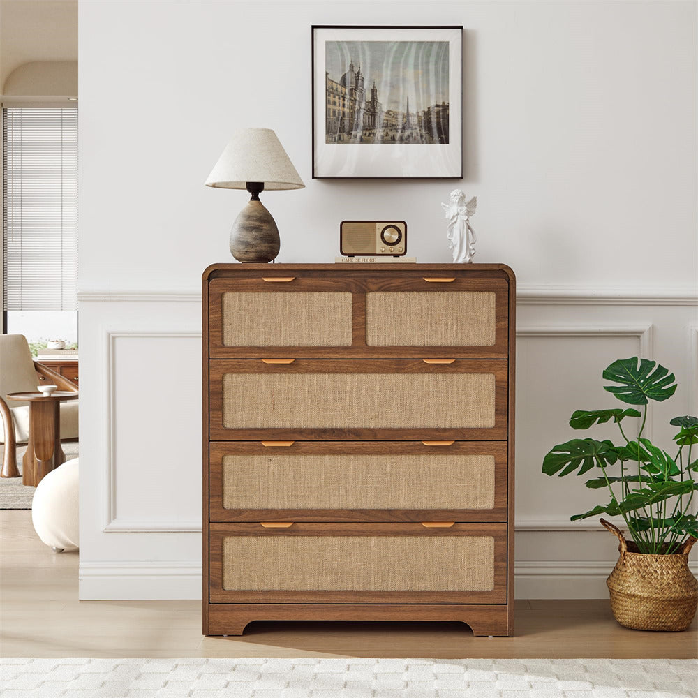 Wooden dresser with woven drawers in a room setting with decor elements.