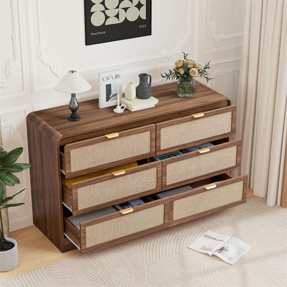 Wooden dresser with fabric drawers in a room setting