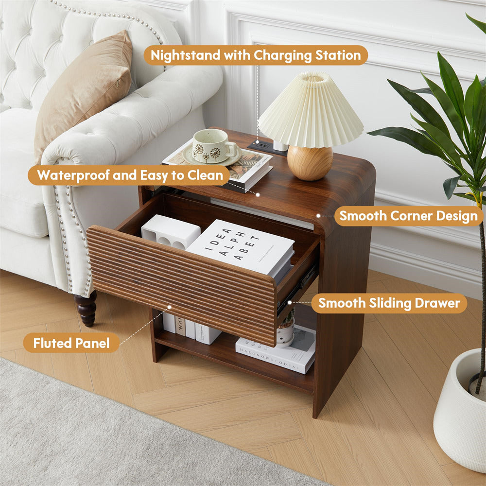Wooden nightstand with charging station in a living room setting