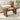 Wooden coffee table with decorative items in a living room setting
