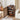 Wooden entertainment console with open door in a living room setting