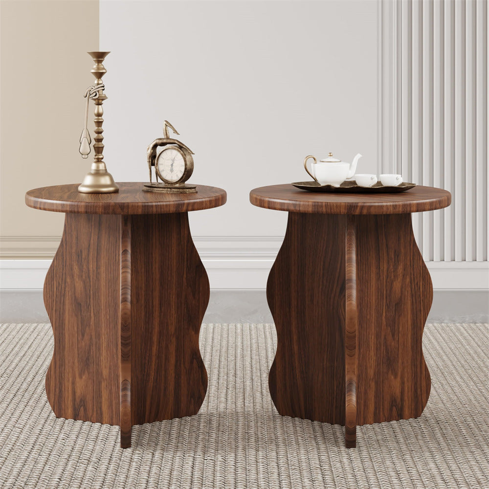 Two wooden side tables with decorative items on a neutral background