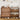 Wooden shoe cabinet with multiple compartments filled with shoes, placed against a wall with decorative items.