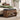 Wooden bench with storage compartments in a bedroom setting