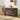 Wooden shoe bench with storage compartments, shoes, and bags in a room setting.
