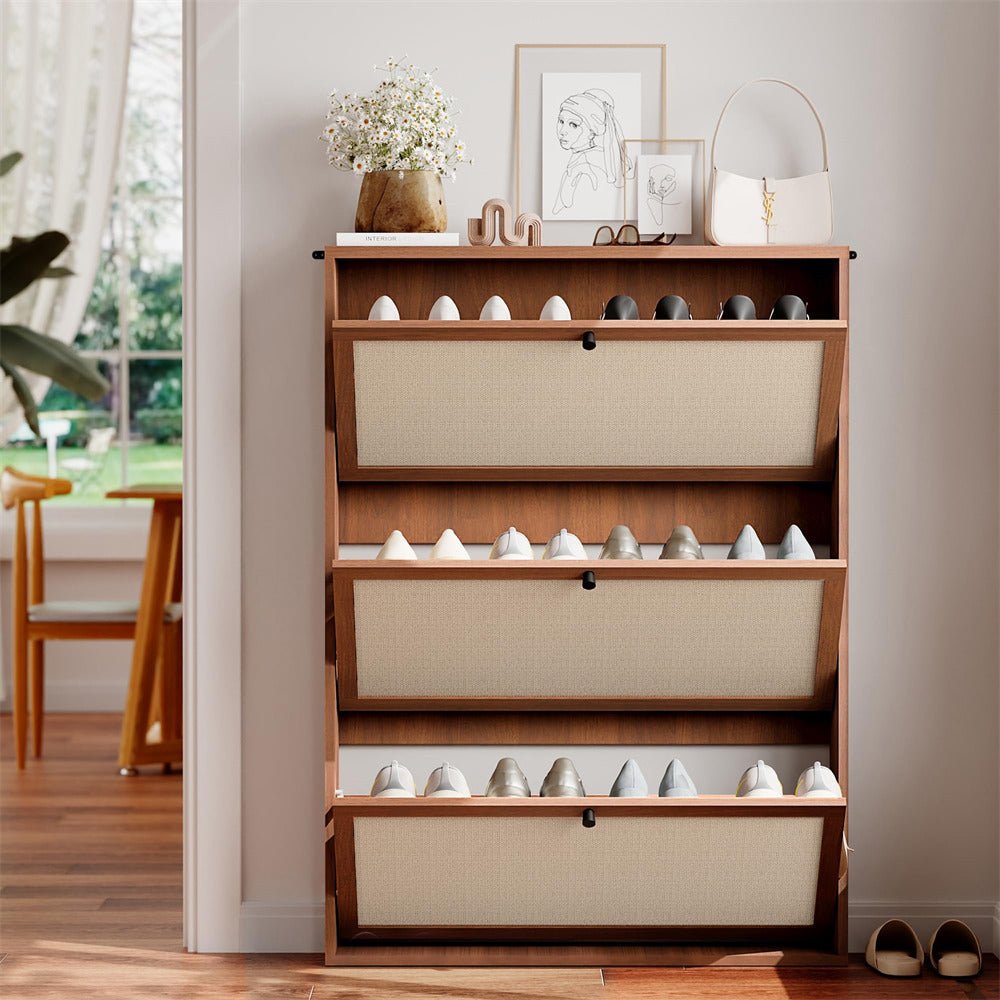 Wooden shoe rack with fabric-covered compartments in a room with a window and plant.