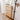 Wooden shoe cabinet with decorative items in a hallway