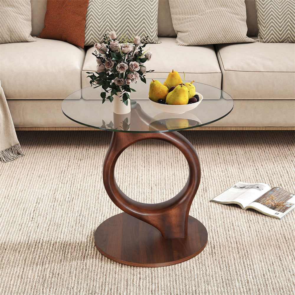 Glass coffee table with wooden base in a living room setting