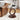 Wooden side table with glass top in a living room setting