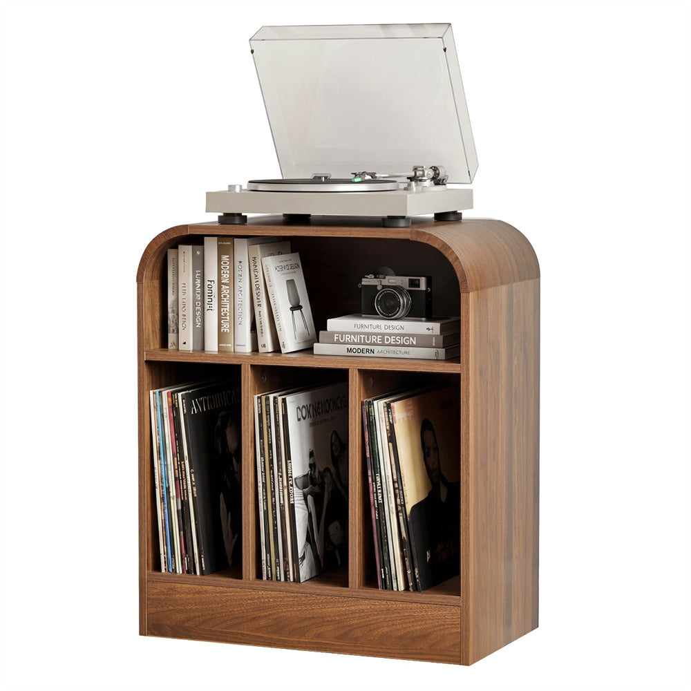 A walnut wood record player console with three open shelves, shown holding vinyl records, books, and a camera. The record player on top has its vinyl record cover open.